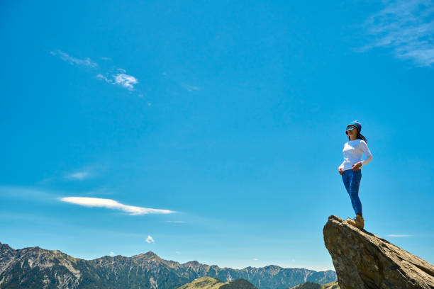 istock Hiker on the top of the mountain peak. 1490357794