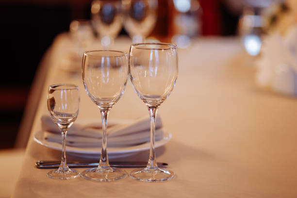 istock Three crystal or glass goblets on tables served 1490360180