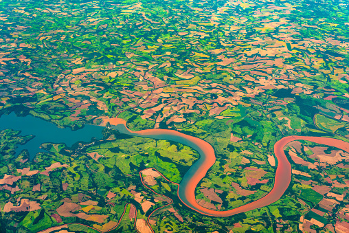 Aerial view of a river and farms in Brazil