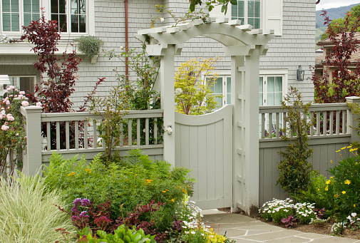 Charming garden gate with trellis and pretty flowers