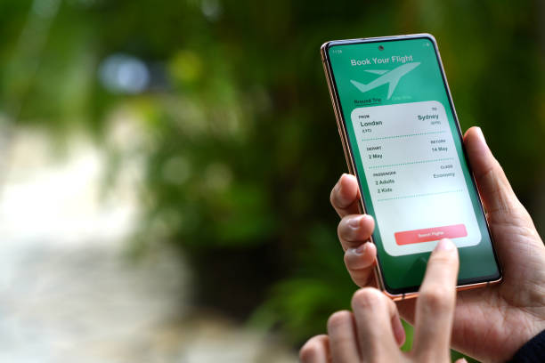 istock The cropped image shows an Asian woman using a smartphone to book flight tickets and plan her holiday. 1490362308