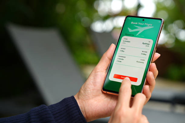 istock The cropped image shows an Asian woman using a smartphone to book flight tickets and plan her holiday. 1490362726