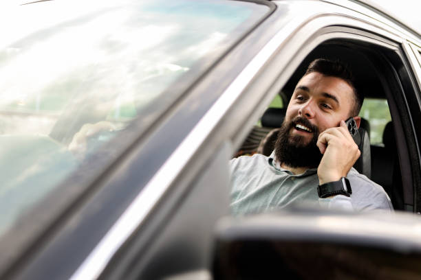istock Driving and talking on a phone 1490366324