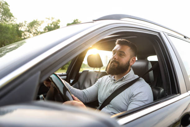 istock Businessman driving a car 1490367455
