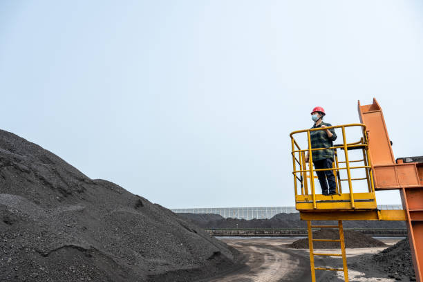 istock A female technician works at a coal port 1490371603