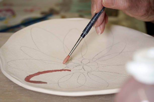 istock Craftsman, pottery, ceramist, sculpture, workshop, art, group of people, training 1490373463