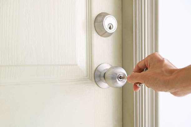 istock Man's hand opening the door with a key 1490373513