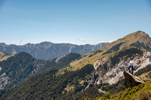 Hiker on the top of the mountain peak.