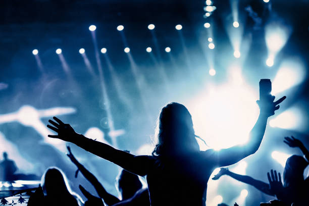 istock Woman enjoying a concert party 1490380900