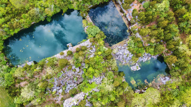 istock Drone view of large empty abandoned quarry with rectangular bodies of water 1490382039