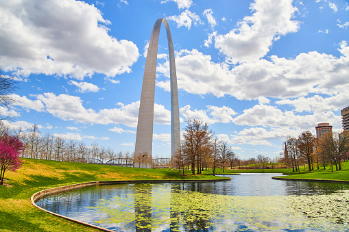 Image of Early spring at St. Louis's iconic Gateway Arch next to pond