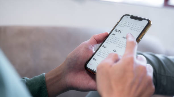 istock Concept for financial planning and reminder for 2024. man using smartphone working with calendar 2024, business planning marketing and investment 1490382915