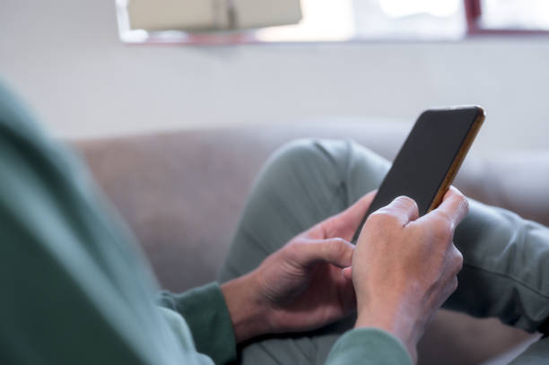 istock social media internet network connection concept, man hand holding texting message on screen mobile chatting friend ,search internet information .technology device contact 1490383014