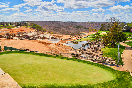 Image of Golf course next to construction revealing caverns