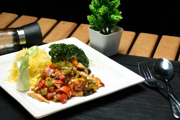 istock Savory Delight: Chicken Chili Dry with Rice and Broccoli on a Plate 1490389739