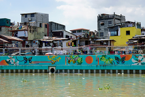 Manila, philippines, circa March 2023 - run down squatter homes at the pasig river
