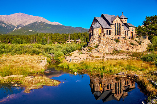 Image of Landscape of Church religion Christianity in the mountain desert with pond reflection
