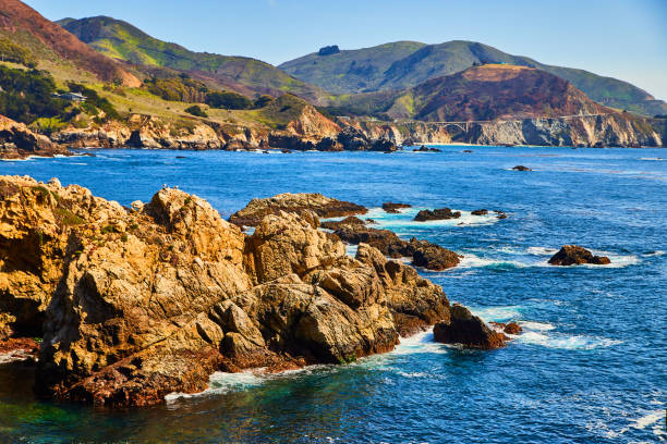 istock Large boulders on west coast with ocean waves 1490394014