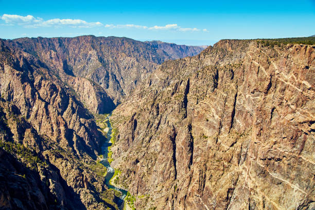 istock Large canyon with brown cliffs and wavy blue river 1490394036