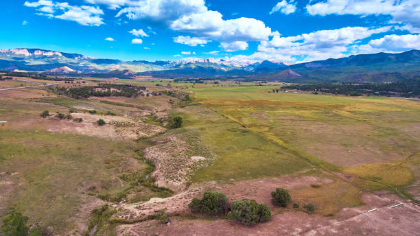 istock Large field of desert with beautiful mountain range in background 1490394138