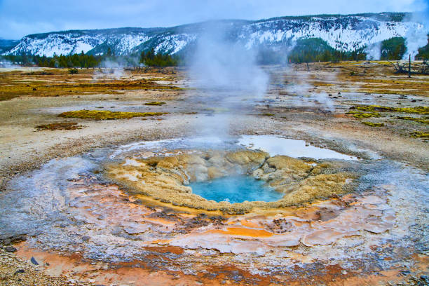 istock Large stunning alkaline geyser in Yellowstone during winter 1490395101