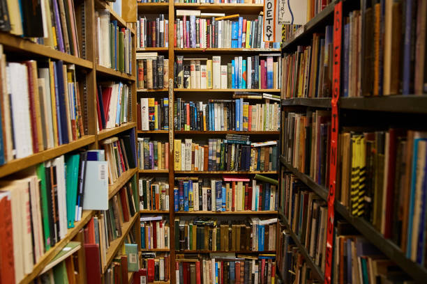 istock Library bookstore dead end with shelves covered in books 1490395520