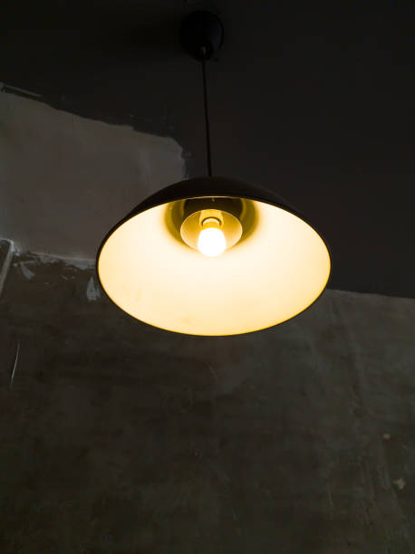 istock Old pendant lamp that glows yellow 1490395845