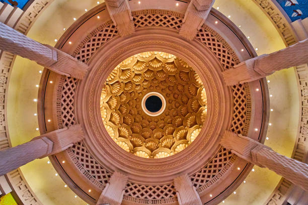 istock Looking up at ceiling with golden shells and surrounded by big pillars 1490397374