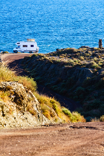 Camper rv camping on sea shore. Mediterranean region of Costa Almeria in Andalucia, Spain