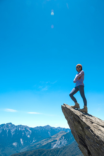 Hiker on the top of the mountain peak.