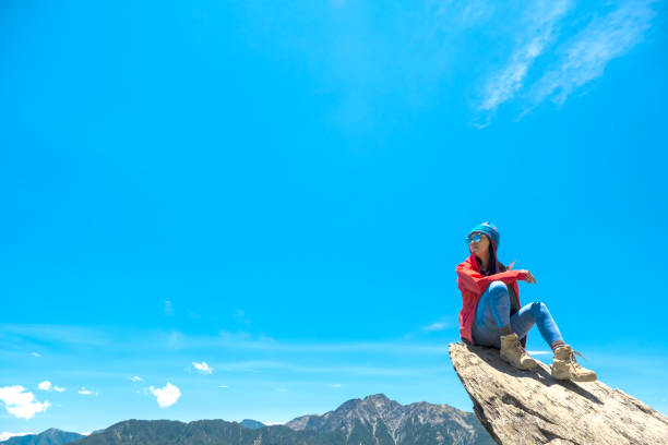 Hiker on the top of the mountain peak.
