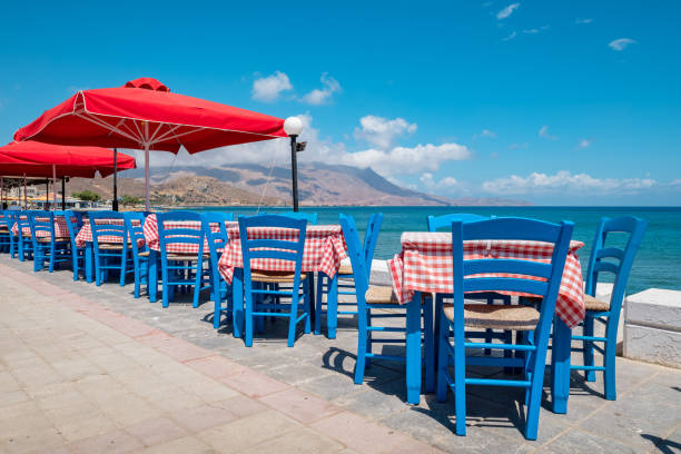 seaside taverna in kissamos. crete, greece - greek culture bar restaurant greece imagens e fotografias de stock