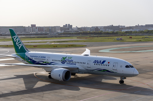 Fukuoka, Japan - April 17, 2023 : General view of the All Nippon Airways (ANA) Boeing 787 Green Jet at Fukuoka Airport in Kyushu, Japan.