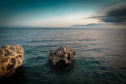 A large rock standing in the sea. sea landscape photo , nature background