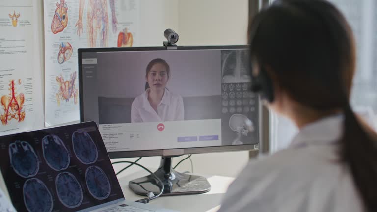 Doctor talking patient on video call in hospital