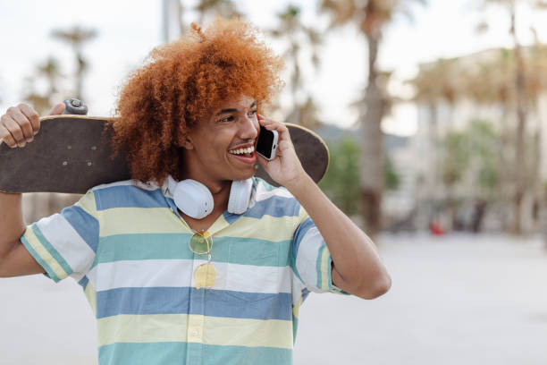 istock A male skateboarder is talking on the phone 1490412060