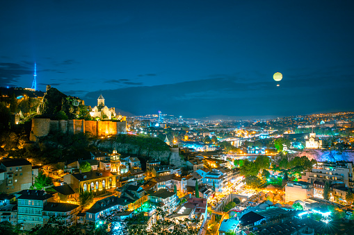 This photo was taken in Tbilisi, Georgia. The photo shows us the view of Narikala . also here are church, moscue and mast. It's important place of Georgia.