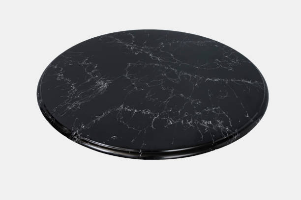 Round black marble table top slab isolated on white background