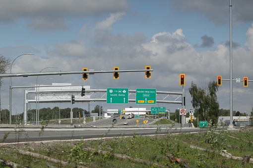 Delta, Canada - May 7, 2023: Intersection in the area of the Highway 91 Connector in North Delta in southwestern British Columbia. Spring morning with clouds over Metro Vancouver.