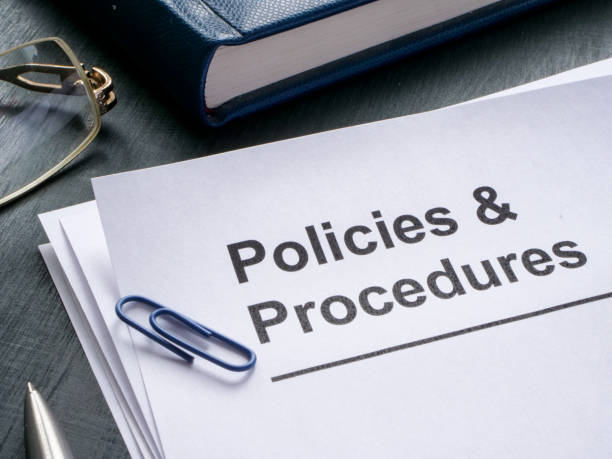 istock Documents about policies and procedures are on the table. 1490413732
