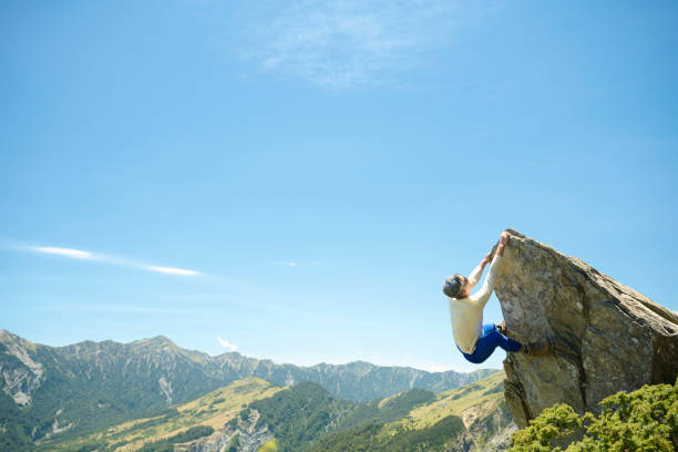 istock Hiker on the top of the mountain peak. 1490414253