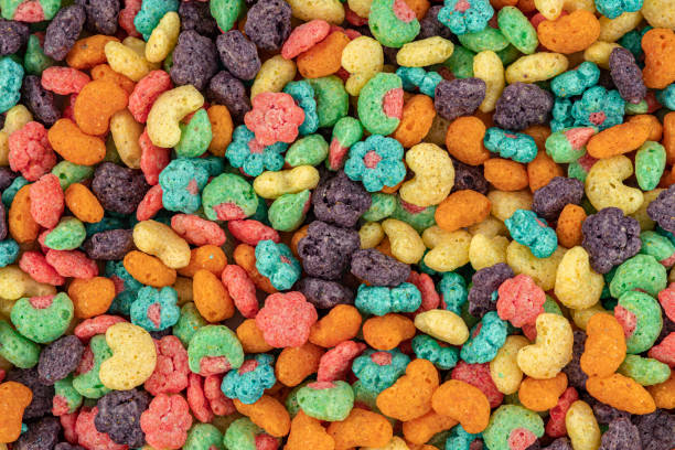 istock Fruit Cereal background. Fruit cereal naturally and artificially fruit flavored sweetened corn puffs. Cereal fruity shapes 1490414257