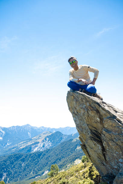 Hiker on the top of the mountain peak.