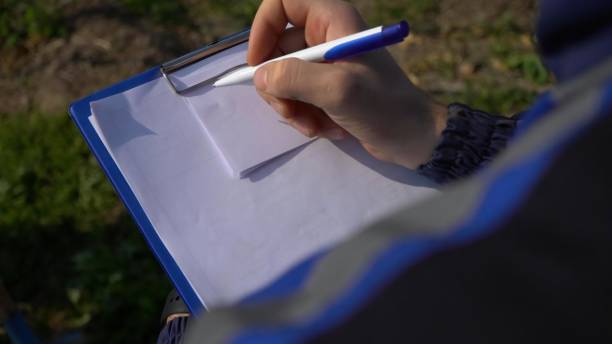 istock Close up of a female hand writing in a notepad 1490415521