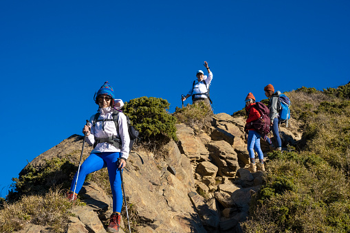 Good friends hiking together on the mountain.