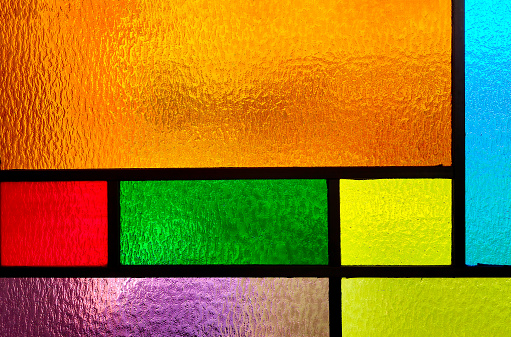 Background of a vivid colored stained glass rectangle design
