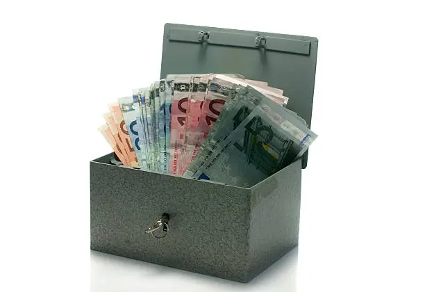strongbox with euro money isolated on white