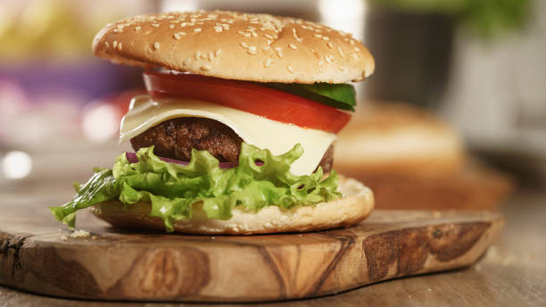 istock fun made fresh burger with marble beef, cheese and vegetables on olive board 1490426121