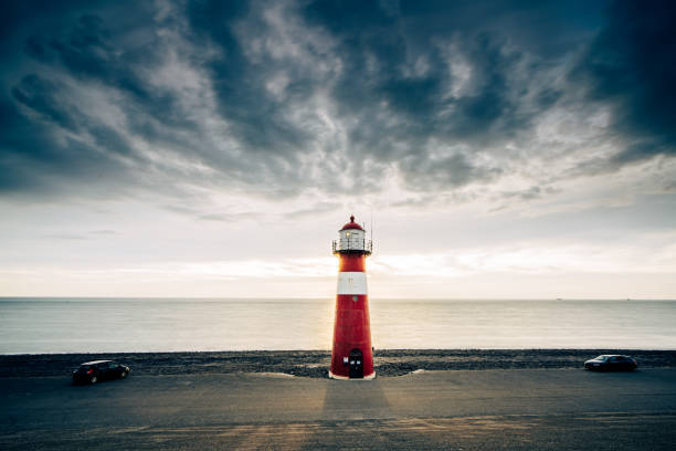 istock Red & white vintage lighthouse at dutch coast in West Kapelle 1490429831