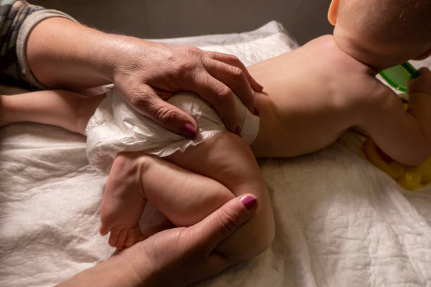 istock Masseur massaging little baby 1490429946